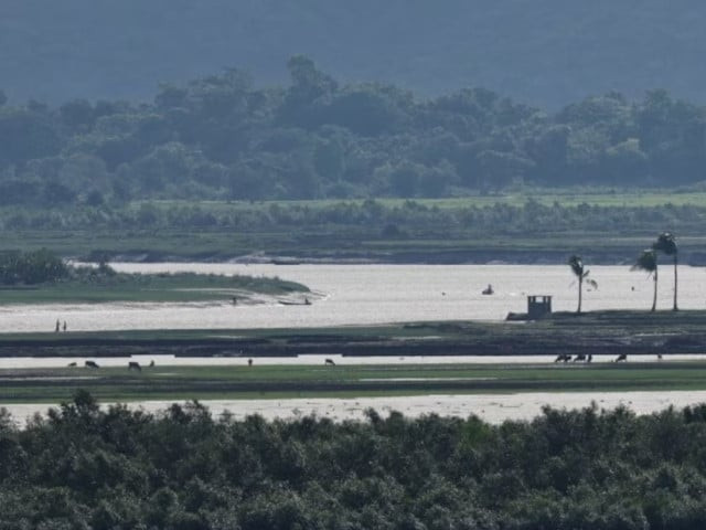 people of maungdaw township of myanmar are seen from the teknaf area of bangladesh at the myanmar bangladesh border during the ongoing conflict in the rakhine state of myanmar in cox s bazar bangladesh june 27 2024 photo reuters